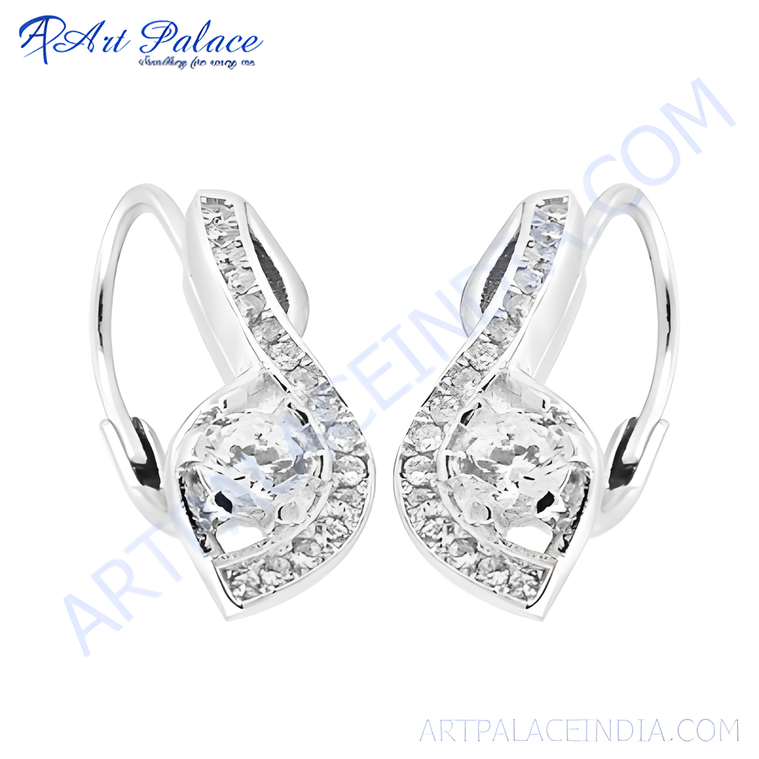 Silver hoop earrings with sparkling cubic zirconia stones, perfect for adding a touch of glamour.