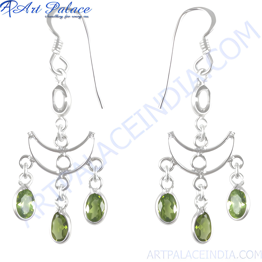 Sterling silver dangle earrings with oval-cut peridot gemstones in a chandelier design.