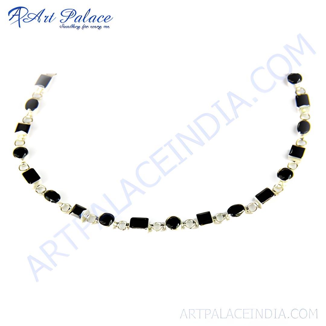 Sterling silver necklace featuring alternating black onyx gemstones and clear cubic zirconia stones.