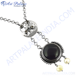 Load image into Gallery viewer, Sterling silver onyx and pearl pendant necklace, featuring a large black gemstone and two dangling pearls.
