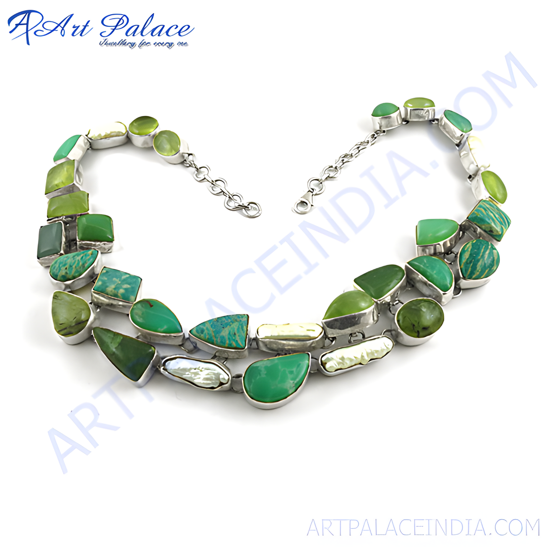 Sterling silver necklace with various shades of green gemstones in a unique design.