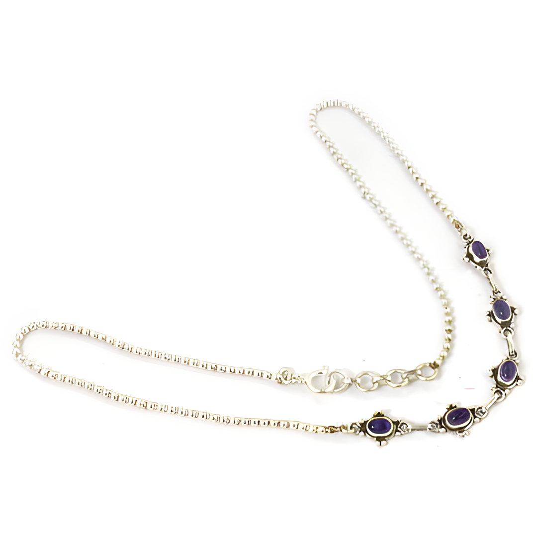 925 sterling silver amethyst necklace with purple gemstone accents on white background.