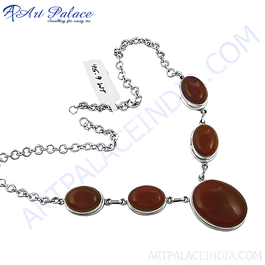 925 sterling silver necklace featuring oval-shaped carnelian gemstones. The reddish-brown stones are set in a silver bezel setting.