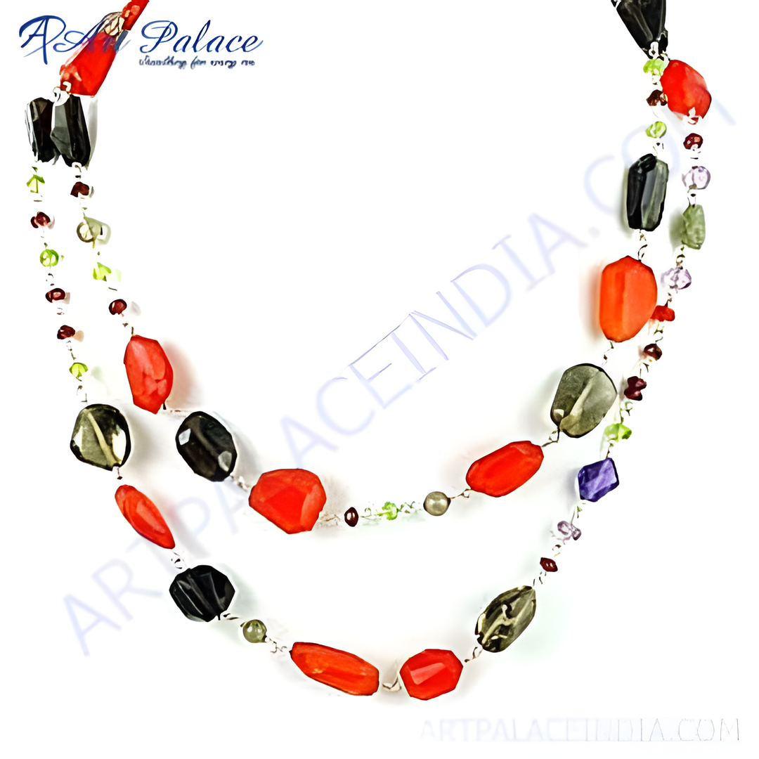 Multi-colored gemstone layered necklace for women. Features red, black, and green stones strung on a delicate chain.