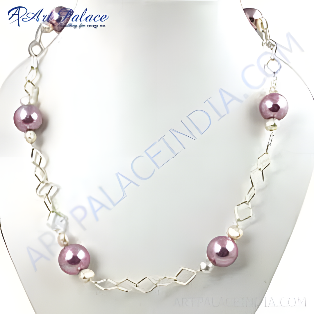 A pearl and silver fashion necklace displayed on a white bust, showing the detail of the necklace.