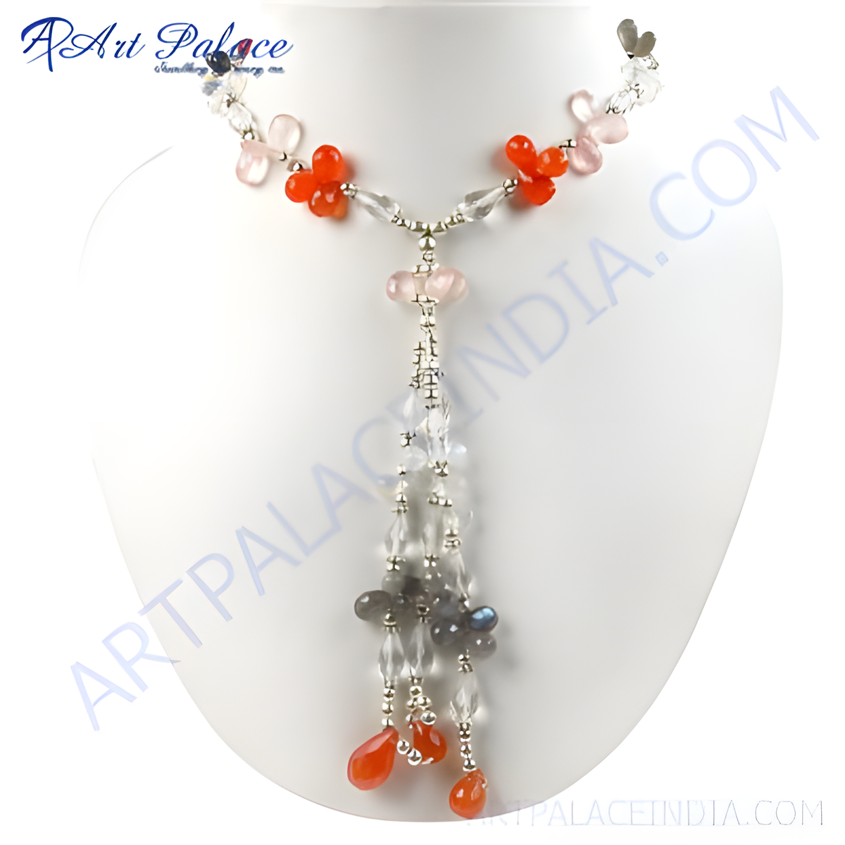 A stunning gemstone flower necklace featuring orange and pink beads with crystal accents, displayed on a white jewelry bust
