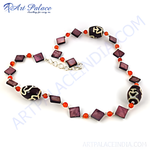 Load image into Gallery viewer, A close-up shot of a beaded necklace with various stone beads.
