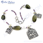 Load image into Gallery viewer, Sterling silver beaded necklace featuring green gemstone pendants and intricate silver detailing, perfect for women&#39;s jewelry.
