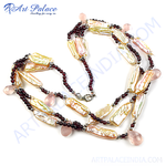 Load image into Gallery viewer, Garnet and pearl necklace featuring a variety of pearl-shaped gems and vibrant red garnet beads, set against a white backdrop.
