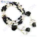 Load image into Gallery viewer, Sterling silver necklace featuring black onyx and white pearls on a white background. This elegant piece is ideal for gifting.
