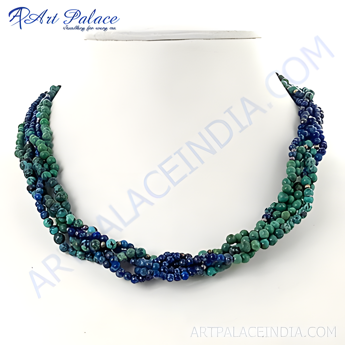 Multi strand gemstone necklace featuring green and blue gemstones strung together on a white background