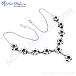 Load image into Gallery viewer, Silver floral hand chain bracelet with black gemstone accents, perfect for party wear.
