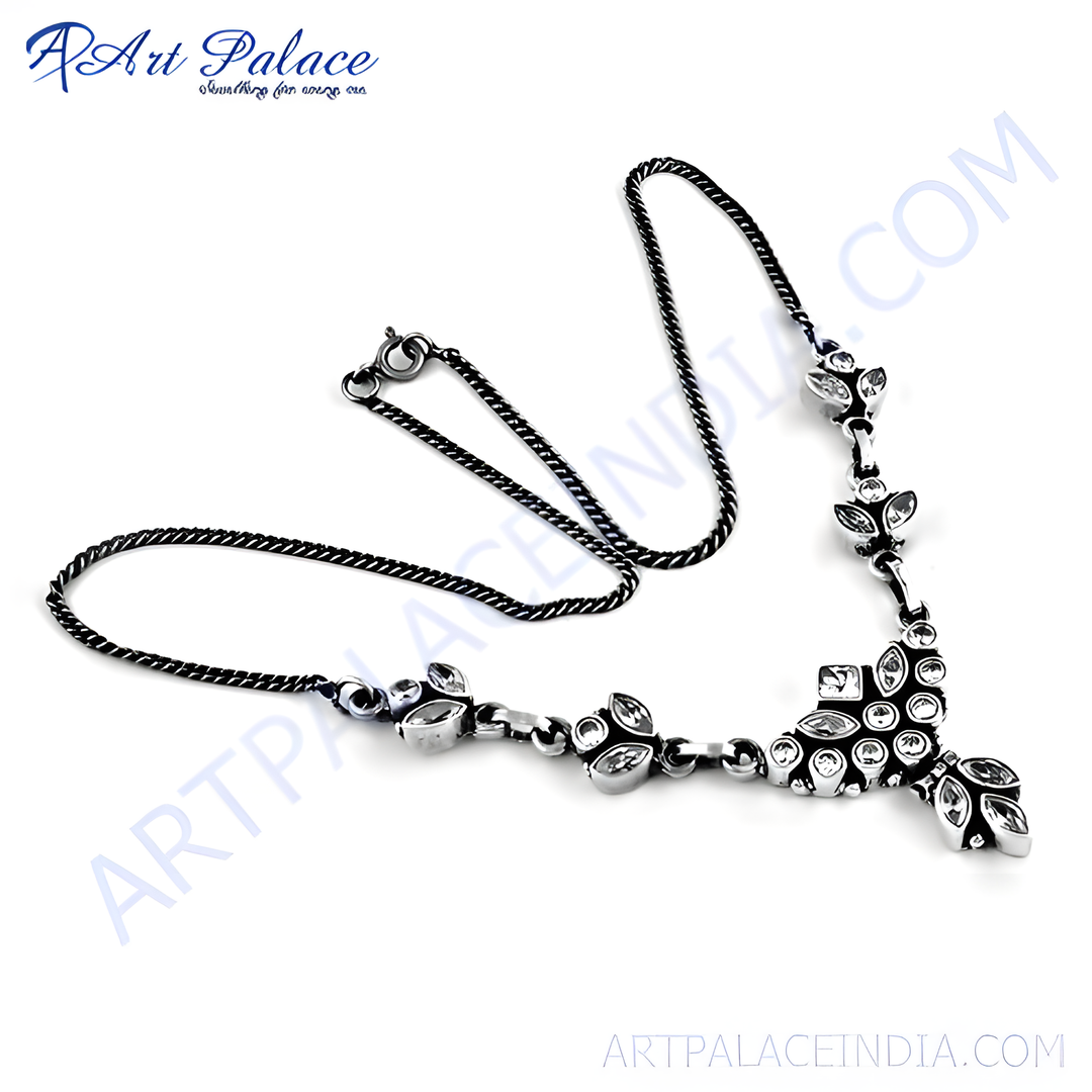 Sterling silver floral necklace with sparkling cubic zirconia stones on a white background, perfect for a gift.