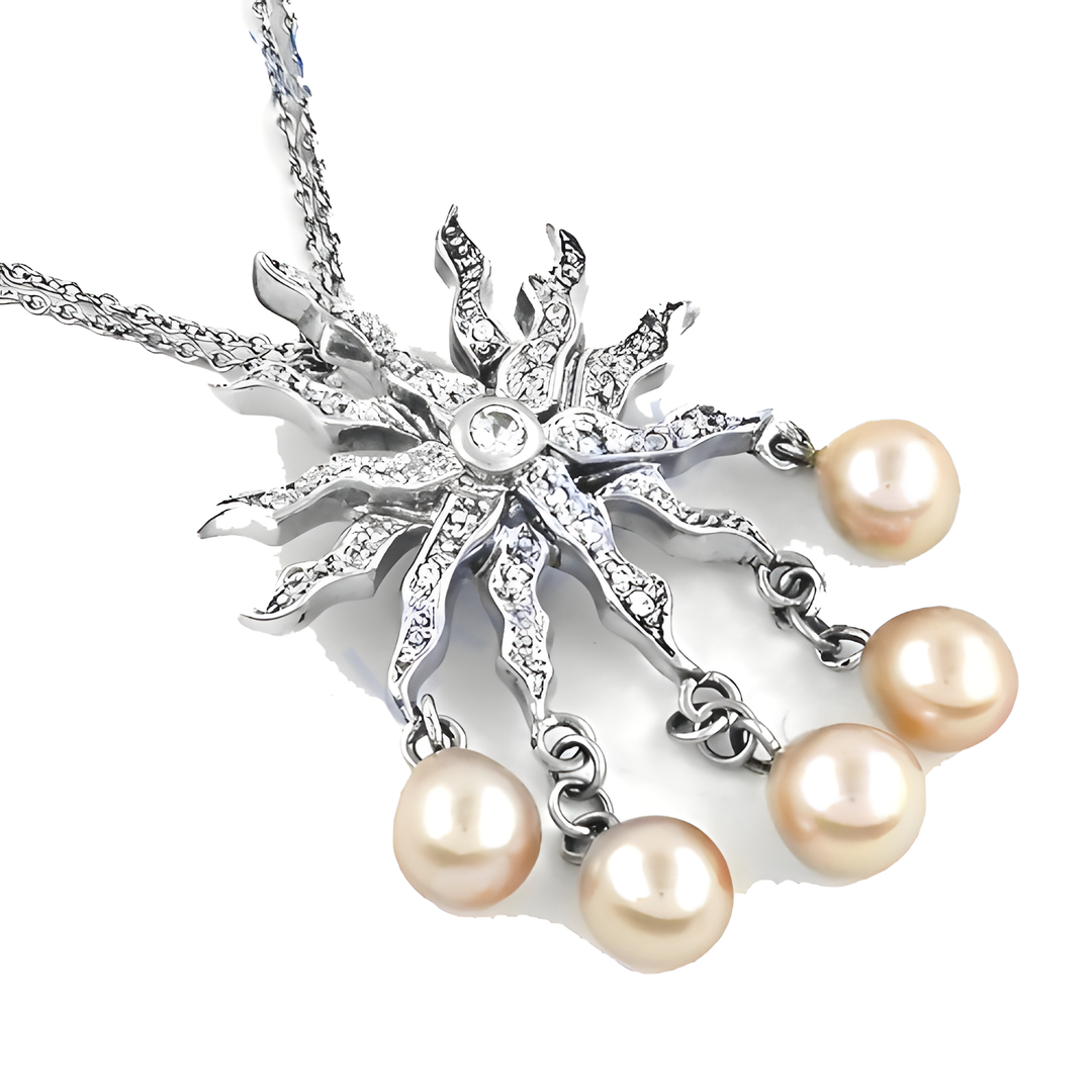 Silver sunburst pendant necklace with pearl drops, a beautiful and elegant piece.
