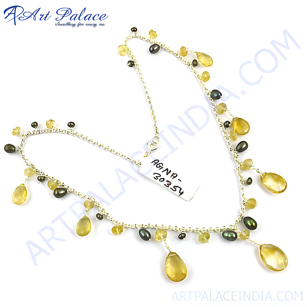 Sterling silver chain necklace with yellow citrine drops and dark pearl accents, elegant and sophisticated.