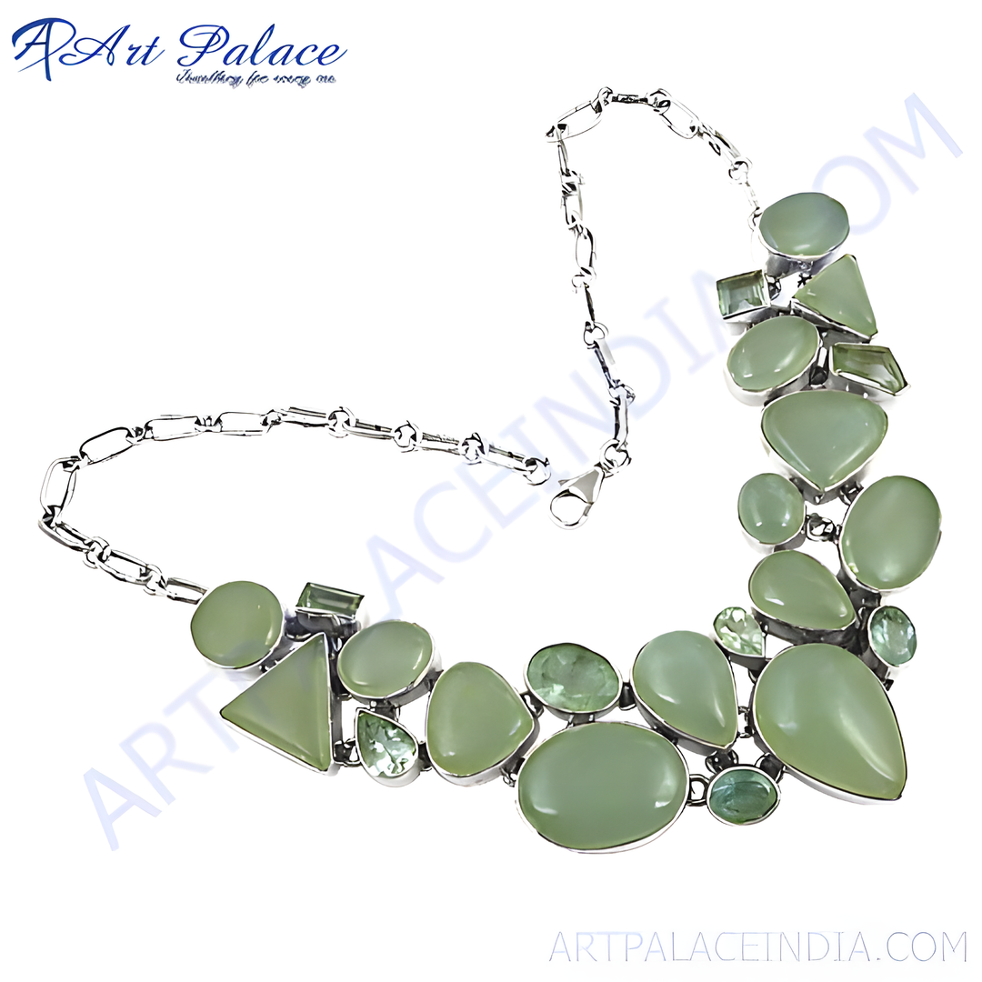 Silver statement necklace featuring various shapes of green gemstones, elegant jewelry piece for women.