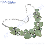 Load image into Gallery viewer, Silver statement necklace featuring various shapes of green gemstones, elegant jewelry piece for women.
