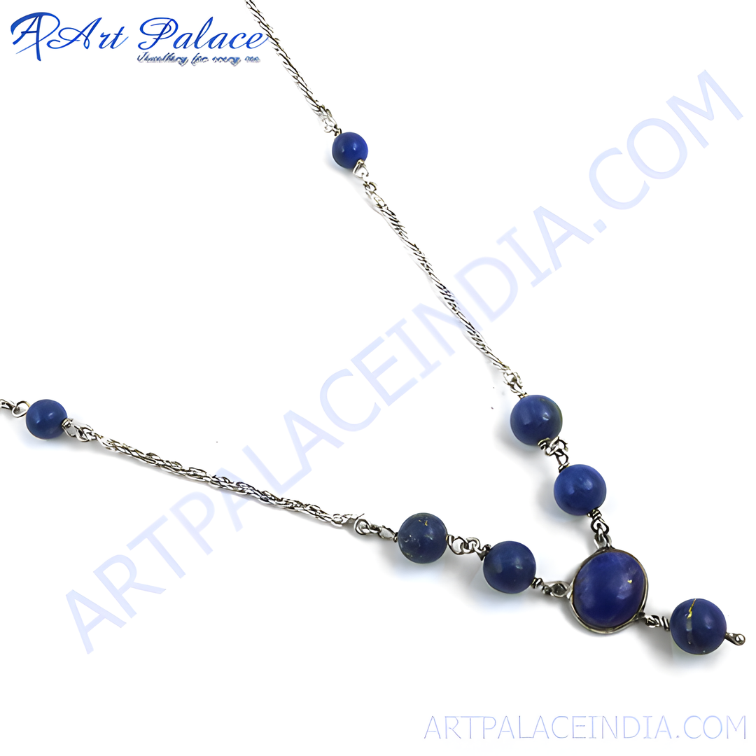 Sterling silver necklace with lapis lazuli beads. Features a delicate chain and blue gemstone details.