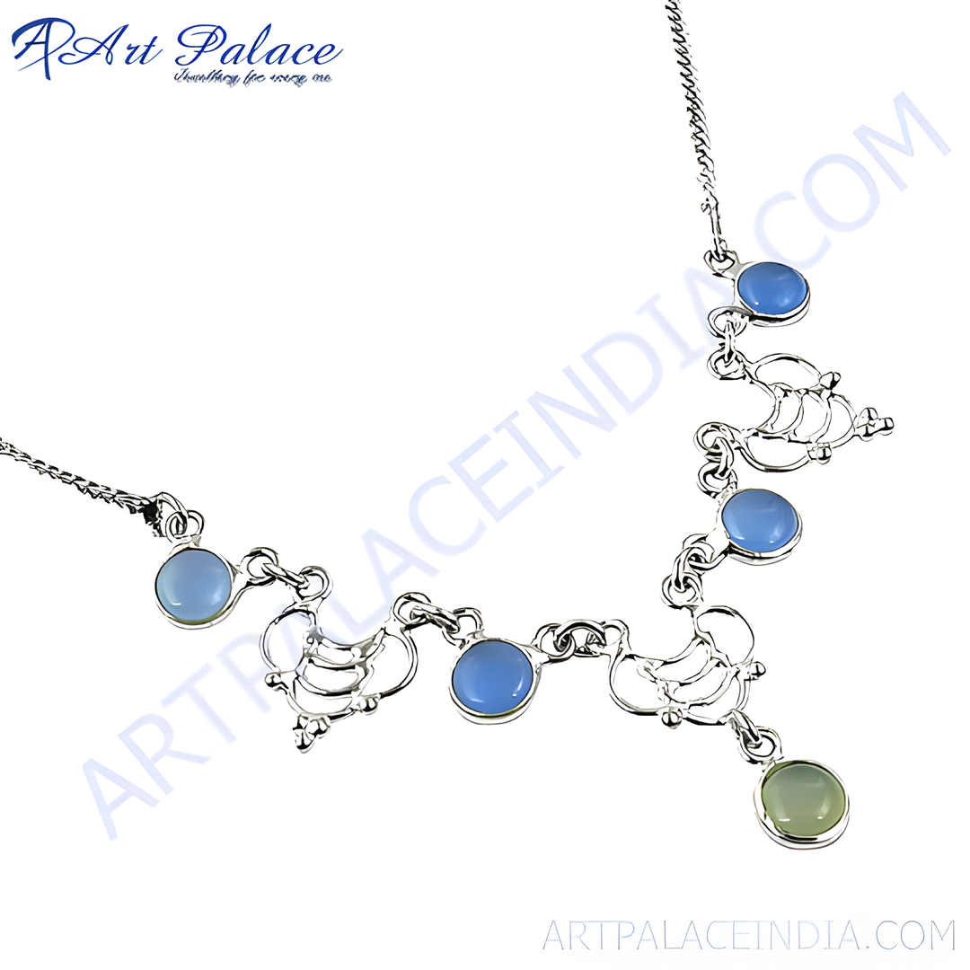 Sterling silver necklace with blue chalcedony gemstones. A delicate silver chain with unique design and a green stone at the end.