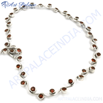 Load image into Gallery viewer, Sterling silver necklace with wave design featuring round, red garnet gemstones, perfect for women.
