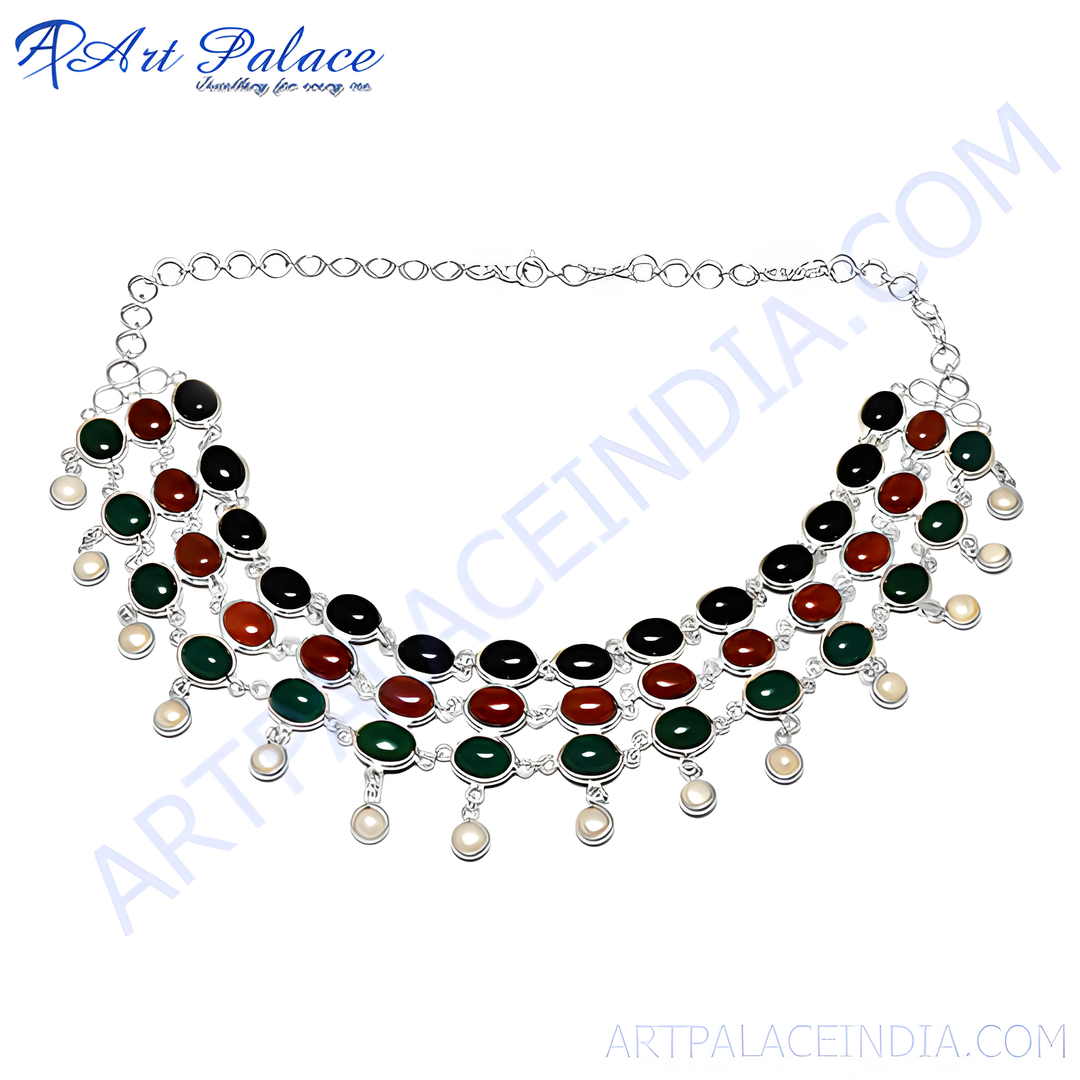 Silver multi-gemstone choker necklace with green, red, and black stones and pearl drops.