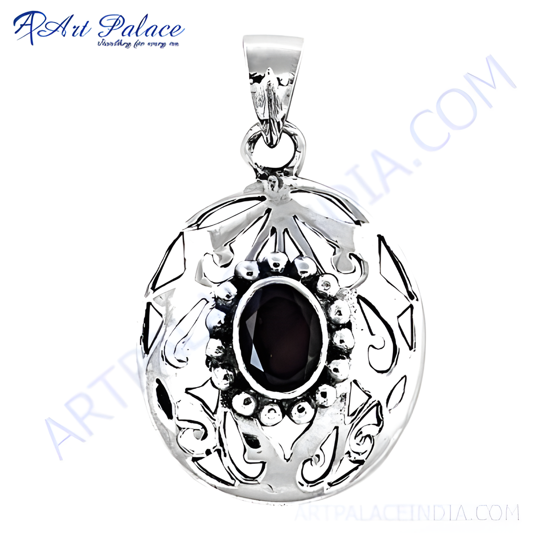 925 sterling silver openwork pendant with a dark red oval garnet gemstone center