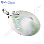 Load image into Gallery viewer, Silver pendant featuring a large oval-shaped natural stone with green and white color.
