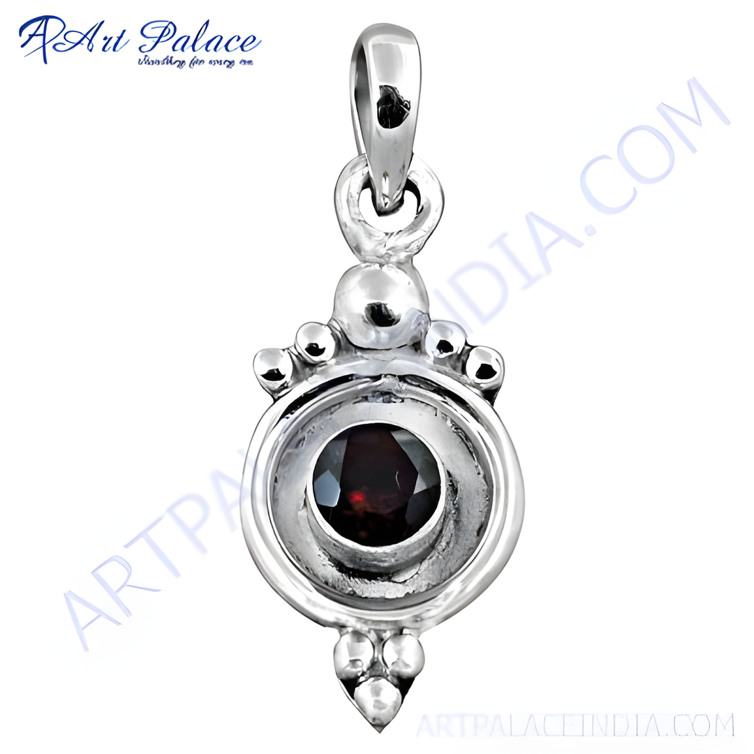 925 sterling silver pendant with a round garnet gemstone center and decorative detailing.