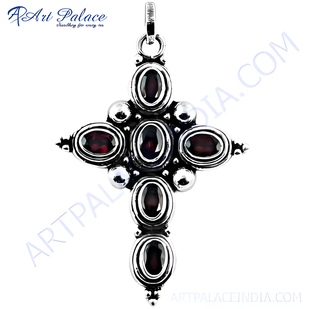925 sterling silver cross pendant featuring oval-cut red garnet gemstones.