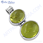 Load image into Gallery viewer, 925 sterling silver pendant with two oval-cut peridot gemstones, light green color
