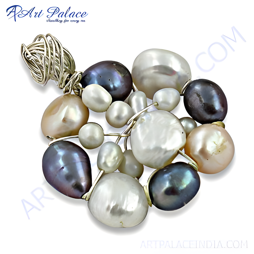 Close-up of a pearl cluster pendant necklace with various pearl colors and a silver wire setting.