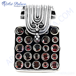 Load image into Gallery viewer, 925 sterling silver charm pendant with black background and many garnet gemstones.
