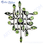 Load image into Gallery viewer, Sterling silver peridot pendant necklace with green gemstones and a geometric design.
