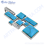 Load image into Gallery viewer, Sterling silver pendant necklace with turquoise gemstones in a unique geometric design.
