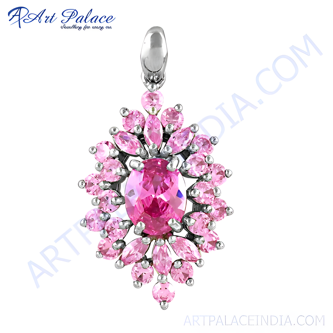 Sterling silver pendant with a large pink gemstone center and smaller pink stones surrounding it.