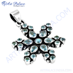Load image into Gallery viewer, Sterling silver flower pendant with vibrant blue topaz gemstones, perfect for women.
