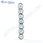 Load image into Gallery viewer, Silver drop earrings with seven round, clear cubic zirconia stones.
