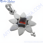 Load image into Gallery viewer, 925 sterling silver flower pendant with a square-cut, dark red garnet gemstone center
