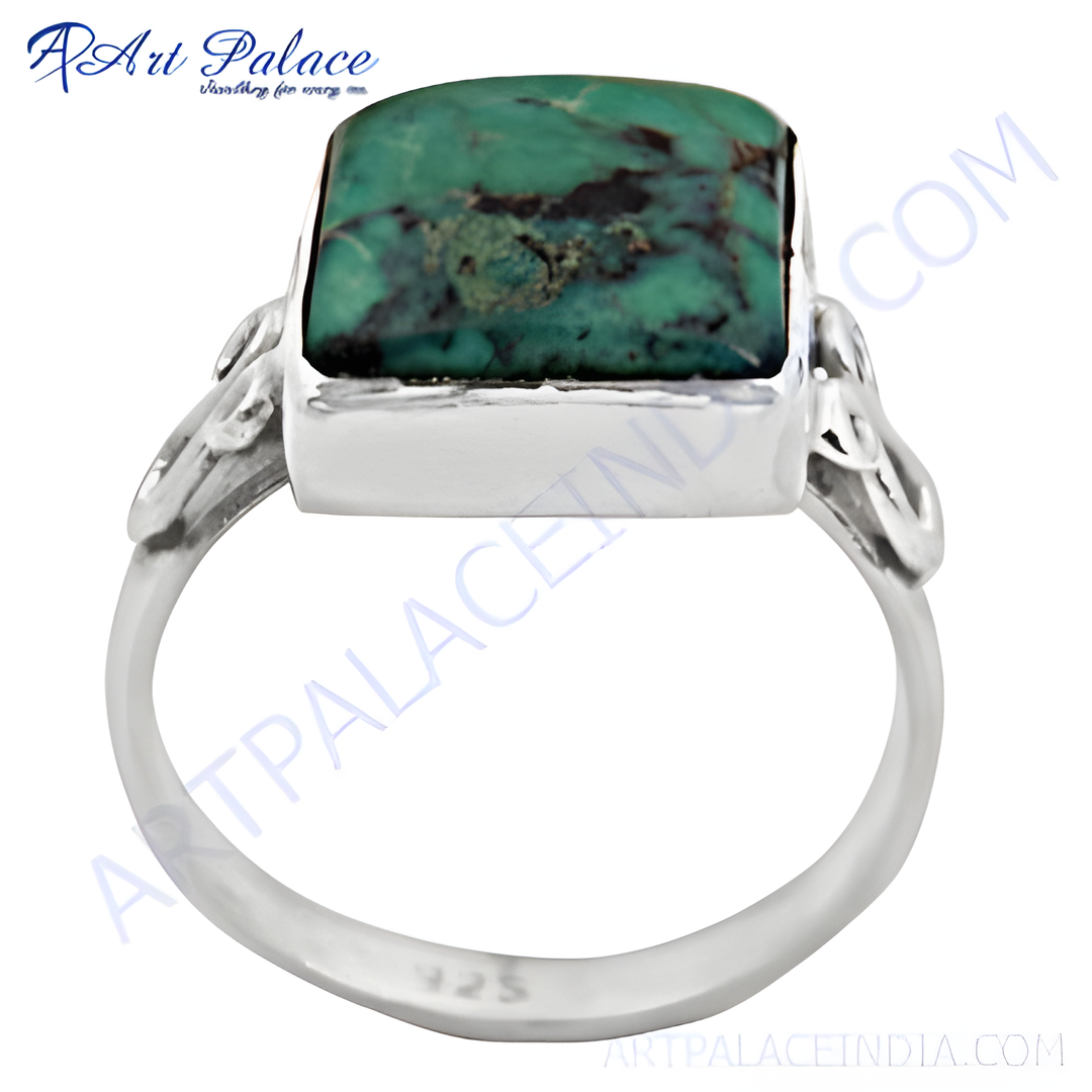 925 sterling silver ring with a square-cut turquoise gemstone. Features a unique, artistic design.