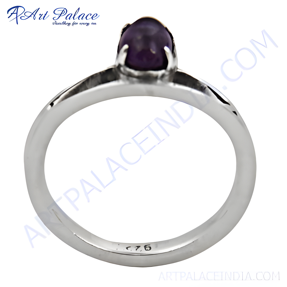 A close up shot of a 925 sterling silver ring with a polished band and a purple amethyst gemstone set in the center