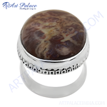 Load image into Gallery viewer, Sterling silver ring with a large, oval-shaped brown and cream-colored gemstone.
