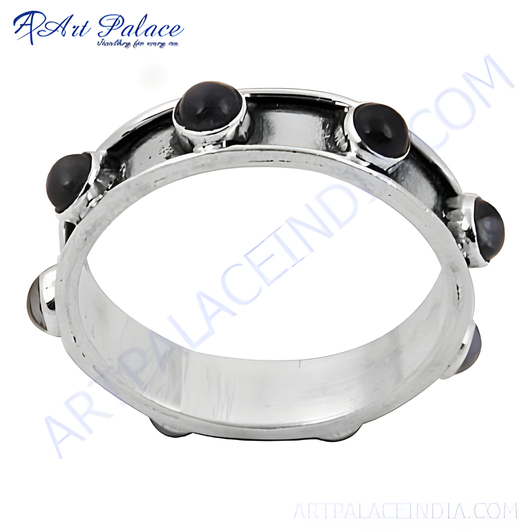 Sterling silver ring with black onyx gemstones, a classic and elegant jewelry piece.