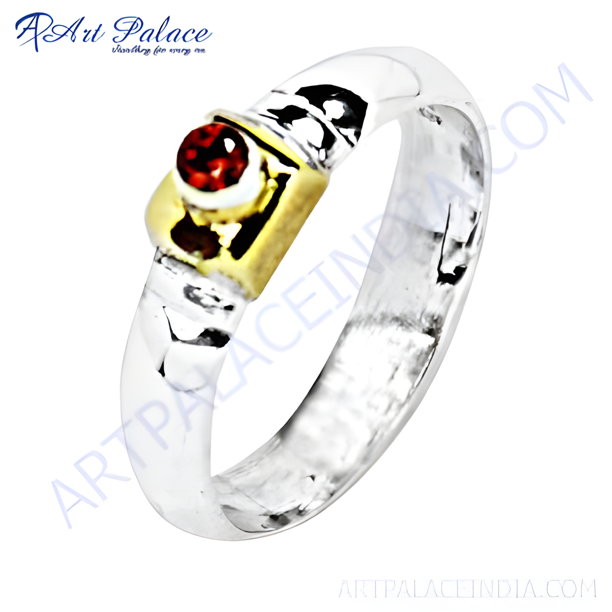 Sterling silver ring featuring a round red garnet gemstone with gold accents, a stunning piece of jewelry