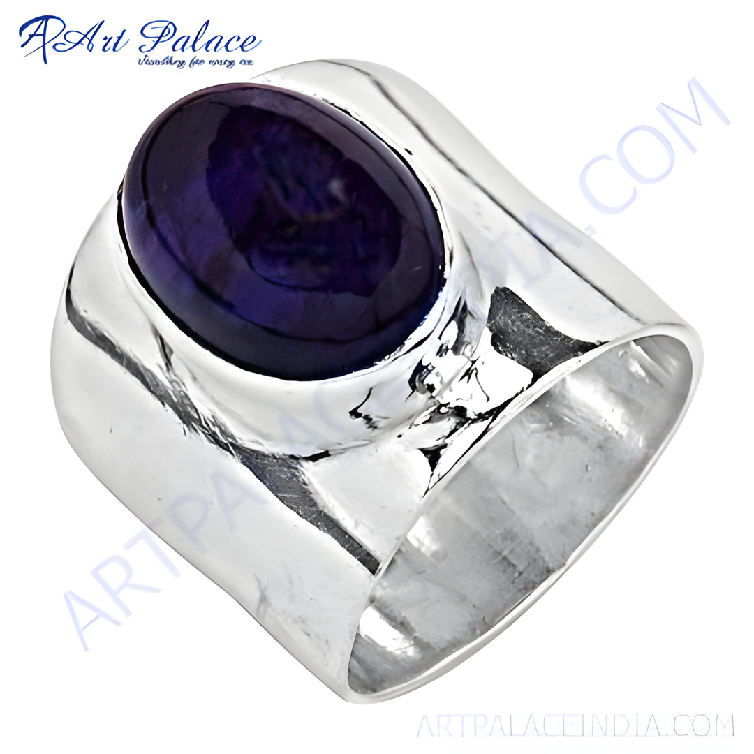 925 sterling silver statement ring with a large oval-shaped blue gemstone. A bold and elegant piece.