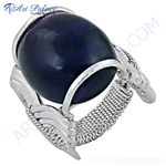 Load image into Gallery viewer, A close-up of a 925 sterling silver statement ring with a large, dark blue gemstone in the center.
