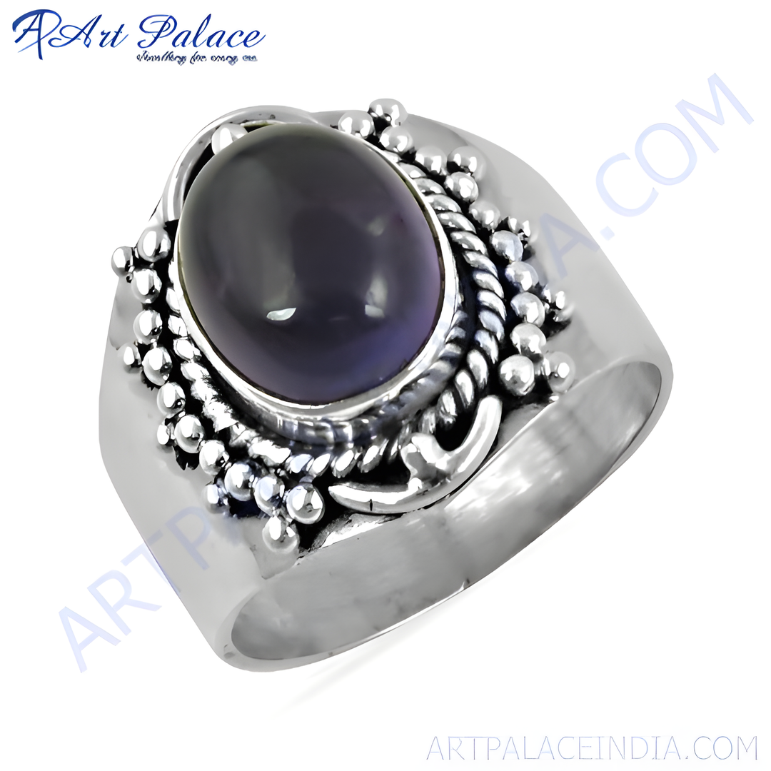 925 sterling silver ring with a large purple gemstone center and ornate silver detailing.