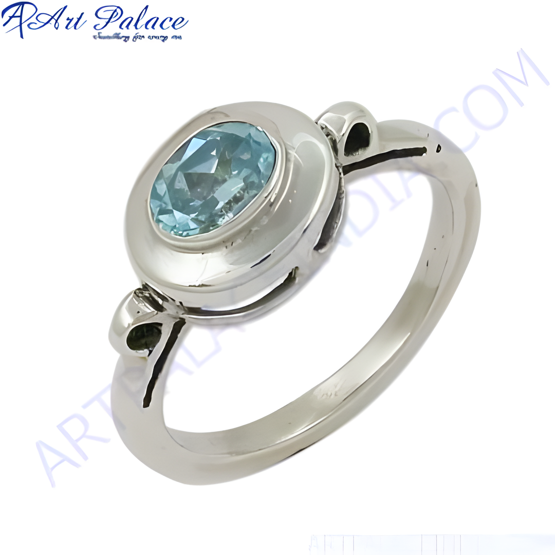 Sterling silver ring with a blue oval aquamarine gemstone. Elegant and timeless design.