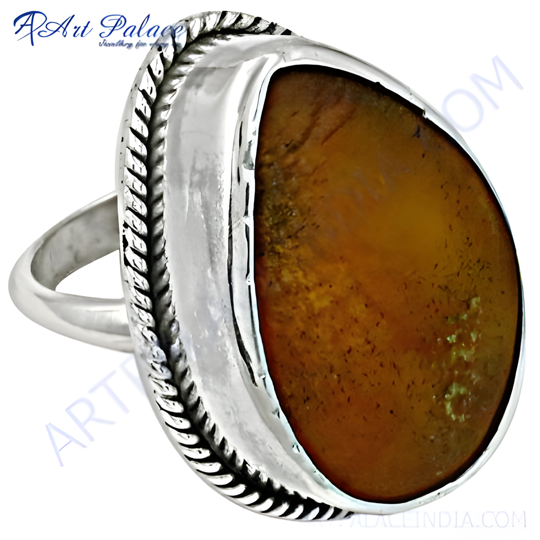 Sterling silver ring featuring a large brown gemstone, perfect for women's jewelry.