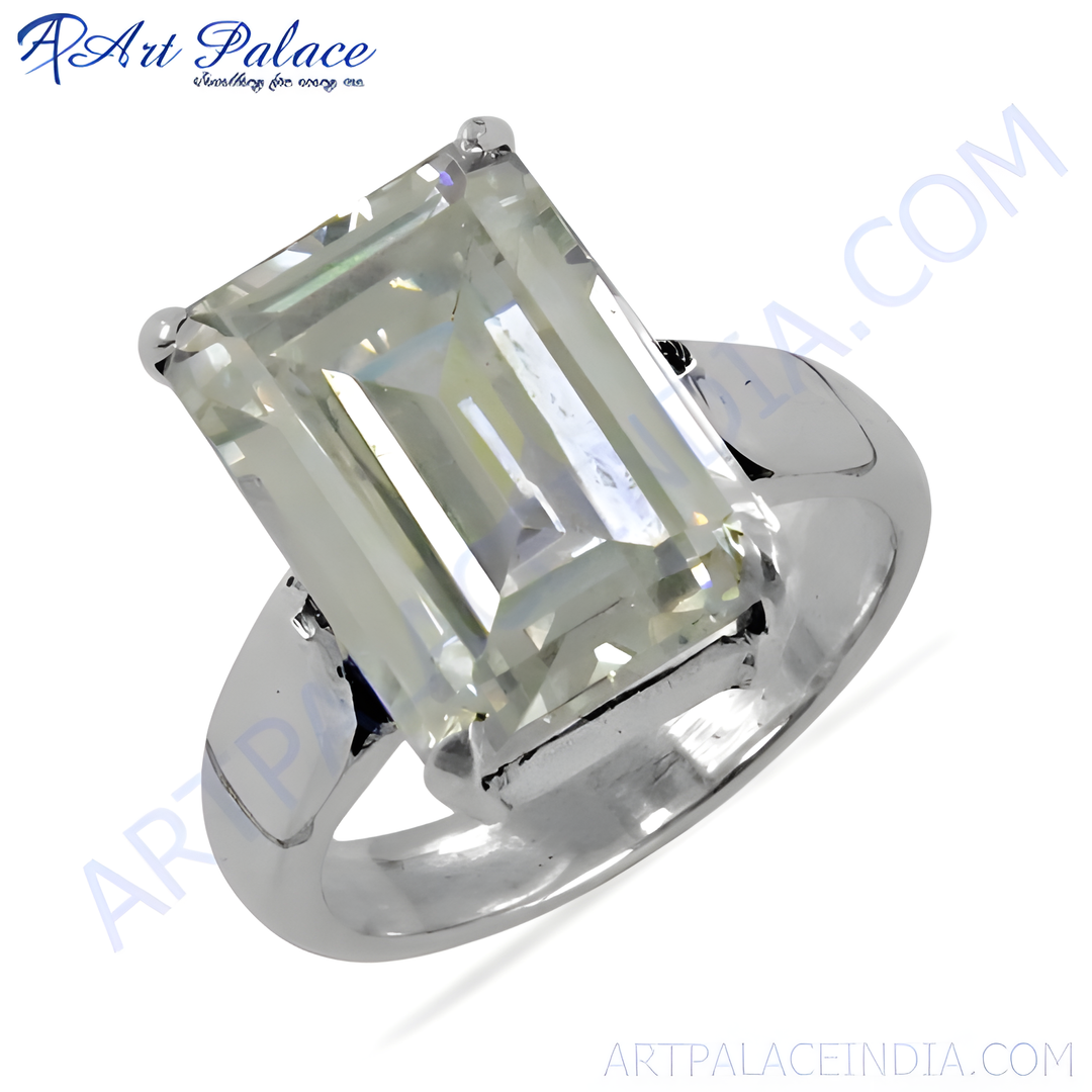 A stunning silver ring featuring a large, rectangular emerald-cut gemstone.