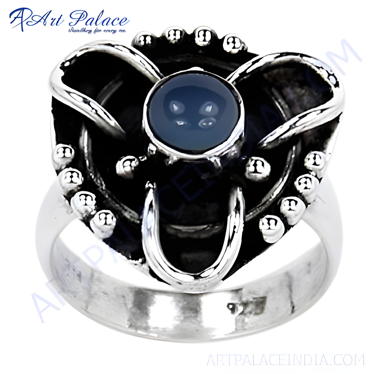 Sterling silver statement ring with a large blue gemstone center, elegant design